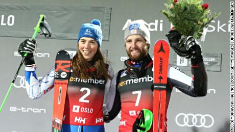 Women's winner Petra Vlhova of Slovakia shares the podium with Austria's Marco Schwarz who was claiming his first World Cup victory in the Oslo city event.