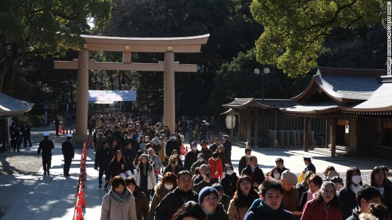 People make their way to offer prayers on the first day of the new year at Meiji Shrine in Tokyo.