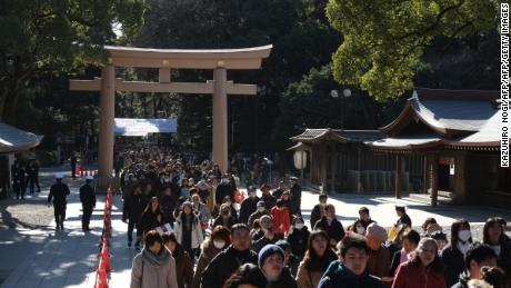 People make their way to offer prayers on the first day of the new year at Meiji Shrine in Tokyo on January 1, 2019.