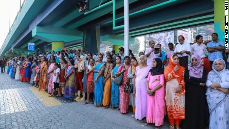 Indian women form a &quot;women&#39;s wall&quot; protest in Kochi in southern Kerala state on January 1, 2019. 