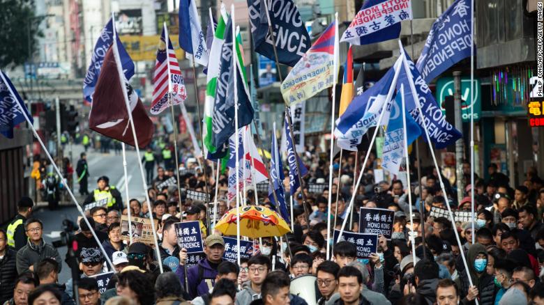 A group of Hong Kong independence supporters display flags during the annual New Year's Day pro-democracy rally in Hong Kong on January 1, 2019.