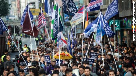 A group of Hong Kong independence supporters display flags during the annual New Year's Day pro-democracy rally in Hong Kong on January 1, 2019.