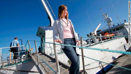 Abby Sunderland walks off a rescue boat in 2010 after her abortive solo voyage.