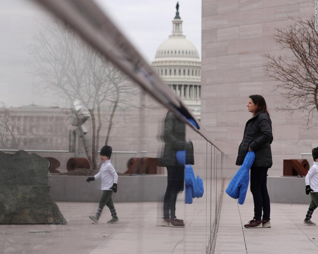 A woman and her child visit the tower deck at the National Gallery of Art in Washington on Wednesday, January 2. It was scheduled to close the next day because of the shutdown.