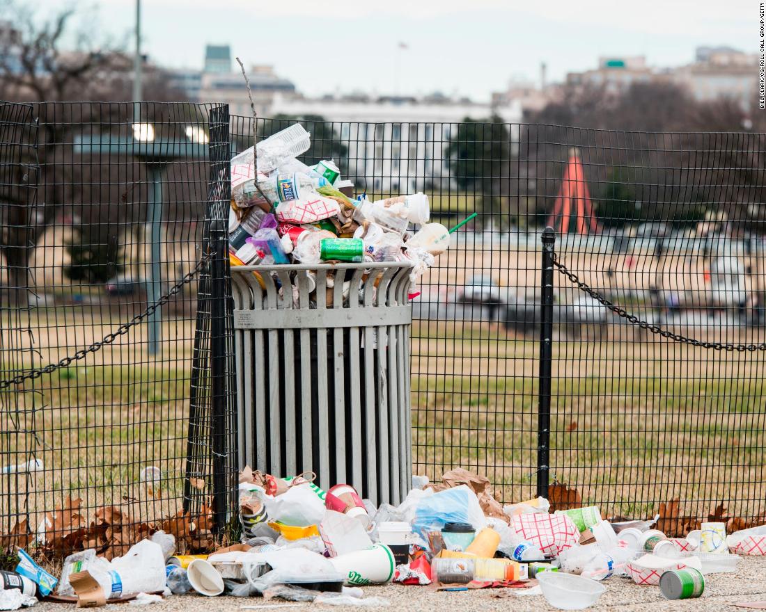 Garbage overflows from a trash can on the National Mall, across from the White House, on Tuesday, January 1. The National Park Service, which is responsible for trash removal, was not operating because of the government shutdown.