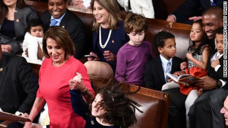 Katie Hill laughs as Nancy Pelosi&#39;s granddaughter reacts to votes for Pelosi to become Speaker of the House.