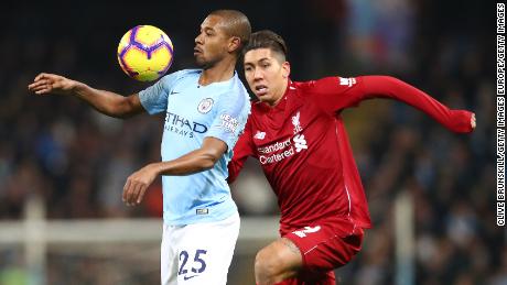 Liverpool's Roberto Firmino challenges Manchester City's Fernandinho during City's 2-1 win in January. 