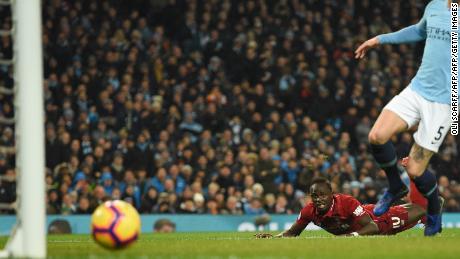 Sadio Mane goes fractionally close to giving Liverpool an early lead. 