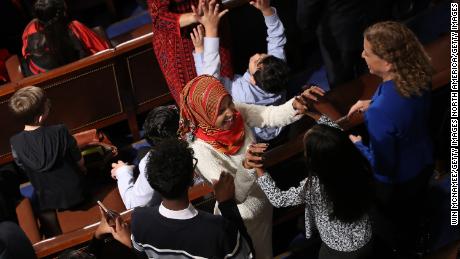 Rep. Ilhan Omar of Minnesota celebrates with her children after taking her oath of office.