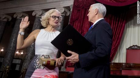 Kyrsten Sinema is sworn in by Vice President Mike Pence.