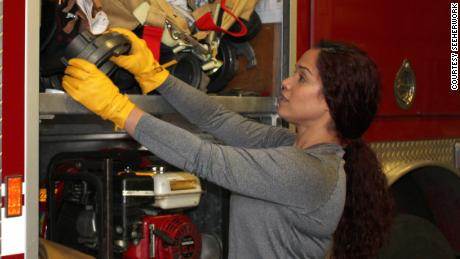 Vivi Rodriguez, a firefighter/paramedic with a large city fire department, wears SeeHerWork gloves on the job.