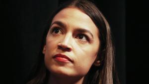 LOS ANGELES, CA - AUGUST 02:  New York U.S. House candidate Alexandria Ocasio-Cortez sits at a progressive fundraiser on August 2, 2018 in Los Angeles, California. The rising political star is on her third trip away from New York in three weeks and is projected to become the youngest woman elected to Congress this November when she will be 29 years old.  (Photo by Mario Tama/Getty Images)