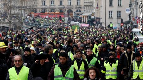 French police investigate reports of decorated officer filmed punching protesters