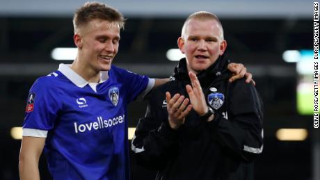 Oldham manager Pete Wild celebrates with player Sam Surridge following Athletic's FA Cup thrid round victory.