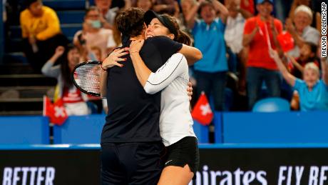 Federer and Bencic celebrate.