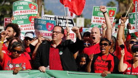 UTLA President Alex Caputo-Pearl, center, joins teachers at a rally December 15, 2018 in Los Angeles.