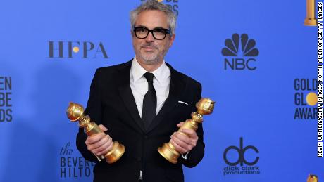 Alfonso Cuarón poses poses in the press room during the 76th Annual Golden Globe Awards 