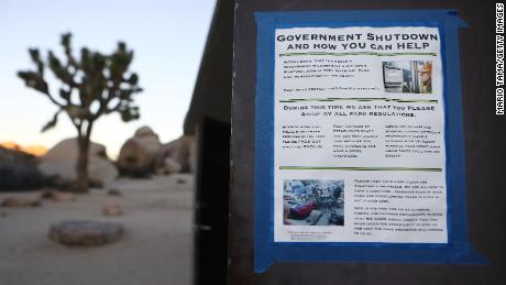 A sign placed by a volunteer is taped to a restroom door at Joshua Tree National Park on January 4, 2019 in Joshua Tree National Park, California. 