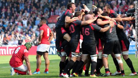 Georgia&#39;s players celebrate defeating Tonga at the 2015 World Cup. 