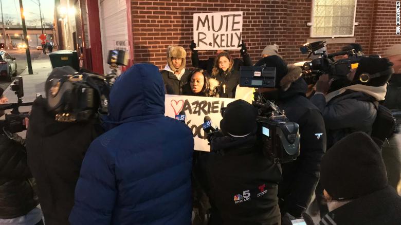 Protesters outside R. Kelly&#39;s studio in Chicago call for a boycott of his music. 
