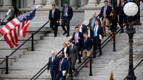 Vice President Mike Pence and other White House staffers leave shutdown negotiations.