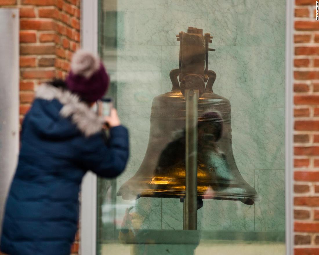 A tourist in Philadelphia takes a picture through a window of the closed building housing the Liberty Bell on January 8. 