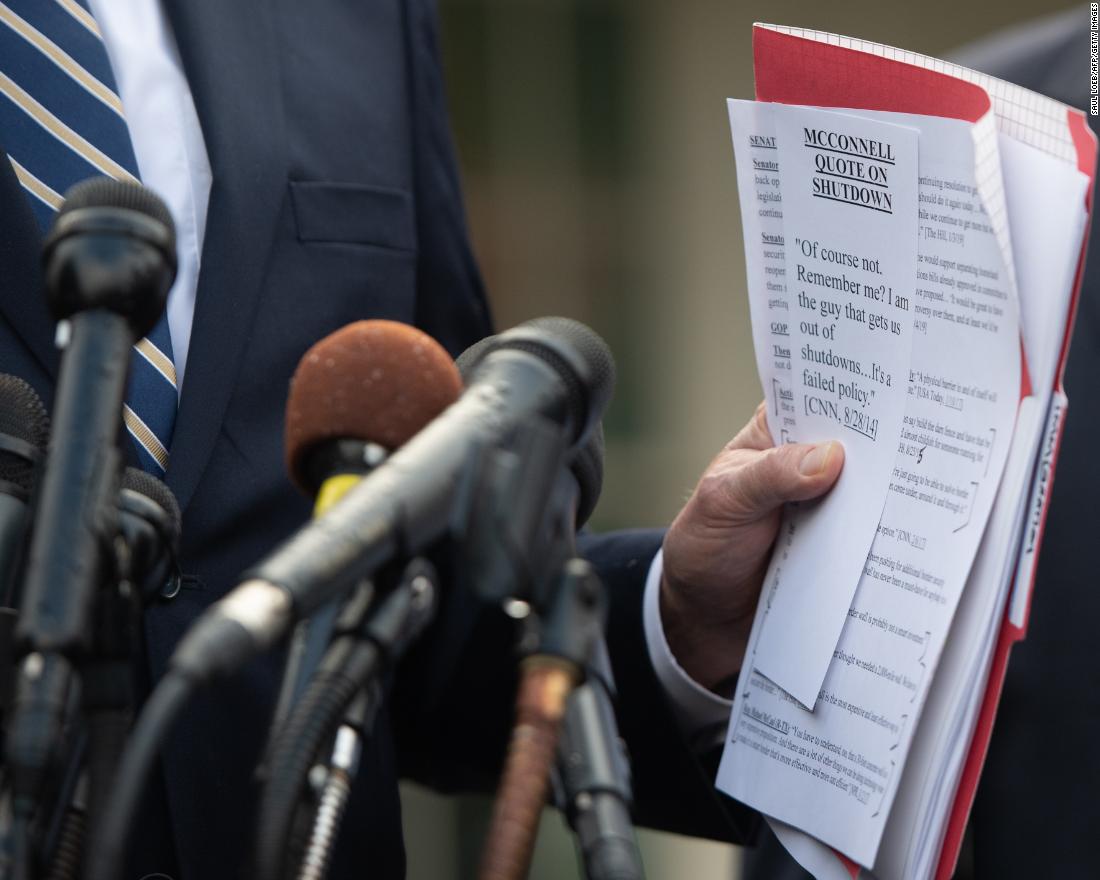 House Democratic Whip Steny Hoyer holds a quote from Senate Majority Leader Mitch McConnell as he speaks to the media on January 9.