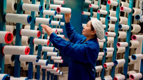 A woman working at a textile factory in Haian, Jiangsu, China. In December, prices of Chinese manufactured goods rose at a much slower pace than expected. 