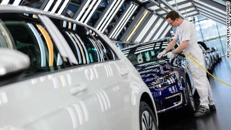 An employee polished an e-Golf electric inside the Volkswagen factory in Dresden, Germany. 