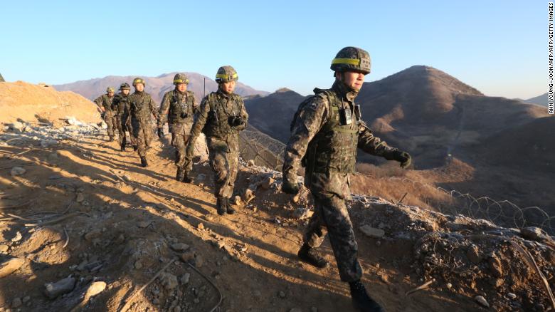 South Korean army soldiers leave for the North to inspect the dismantled North Korean guard post in the central section of the inter-Korean border in Cheorwon, South Korea on December 12, 2018. 