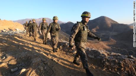 South Korean army soldiers leave for the North to inspect the dismantled North Korean guard post in the central section of the inter-Korean border in Cheorwon, South Korea on December 12, 2018. 