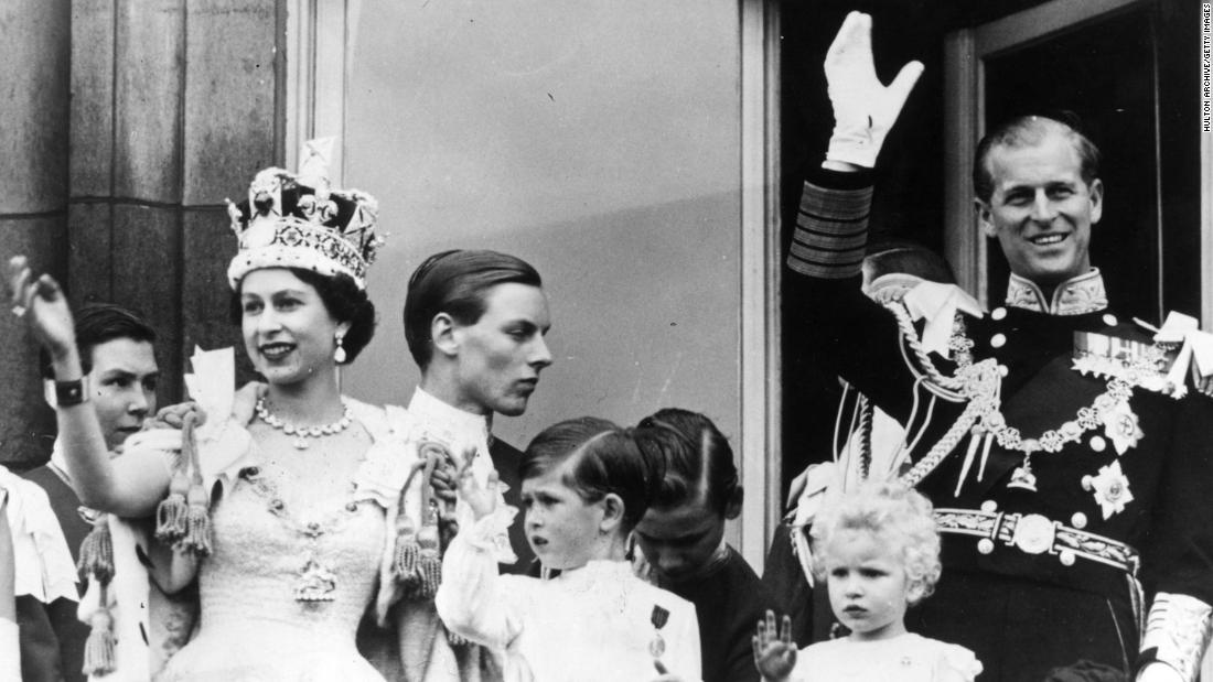 Prince Philip waves from the balcony of Buckingham Palace after his wife&#39;s coronation in June 1953.