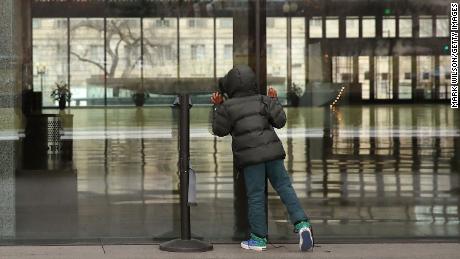 A boy looks inside the National Museum of African American History and Culture, which is closed during the partial government shutdown.