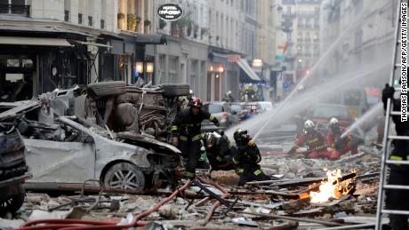 Firefighters intervene after the explosion of a bakery on the corner of the streets Saint-Cecile and Rue de Trevise in central Paris on January 12, 2019.