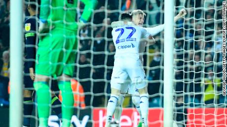 Kemar Roofe and Jack Harrison scored Leeds&#39; goals in their 2-0 win over Derby.
