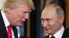 US President Donald Trump (L) chats with Russia's President Vladimir Putin as they attend the APEC Economic Leaders' Meeting, part of the Asia-Pacific Economic Cooperation (APEC) leaders' summit in the central Vietnamese city of Danang on November 11, 2017. / AFP PHOTO / SPUTNIK / Mikhail KLIMENTYEV        (Photo credit should read MIKHAIL KLIMENTYEV/AFP/Getty Images)