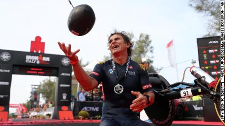  Racing Driver Alex Zanardi of Italy celebrates finishing IRONMAN Emilia Romagna on September 21, 2018 in Cervia, Italy. 