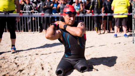 Former Formula One driver and paracyclist Alex Zanardi prepares to dive into the sea to start Ironman 70.3 Italy race on June 18, 2017 in Pescara, Italy. 