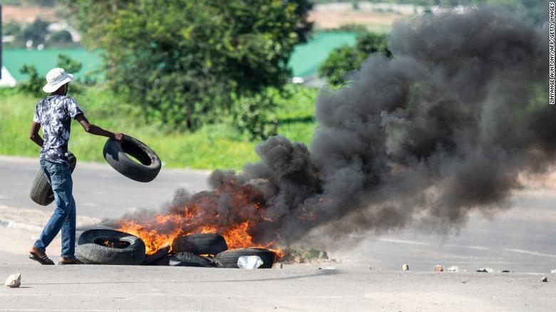 Protesters burned tires in Bulawayo on Monday.