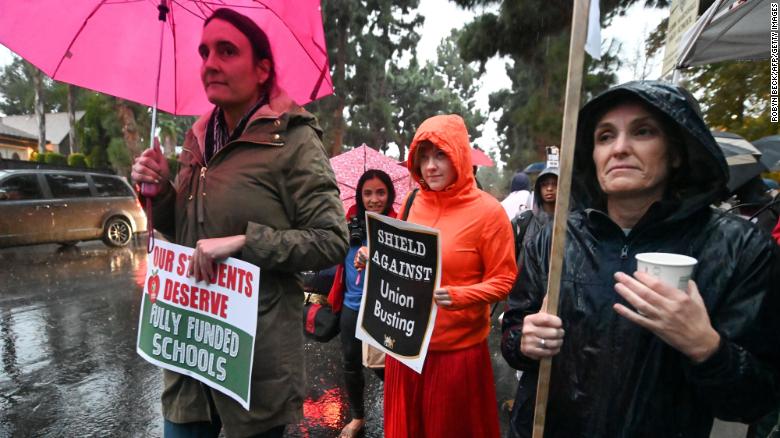 Cold rain Monday didn&#39;t dampen the efforts of teachers demanding more staffing and better pay. 