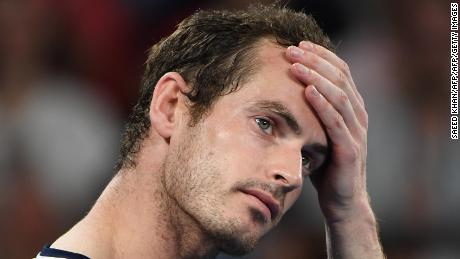 TOPSHOT - Britain's Andy Murray reacts during an interview after his defeat against Spain's Roberto Bautista Agut during their men's singles match on day one of the Australian Open tennis tournament in Melbourne on January 14, 2019. (Photo by SAEED KHAN / AFP) / -- IMAGE RESTRICTED TO EDITORIAL USE - STRICTLY NO COMMERCIAL USE --        (Photo credit should read SAEED KHAN/AFP/Getty Images)