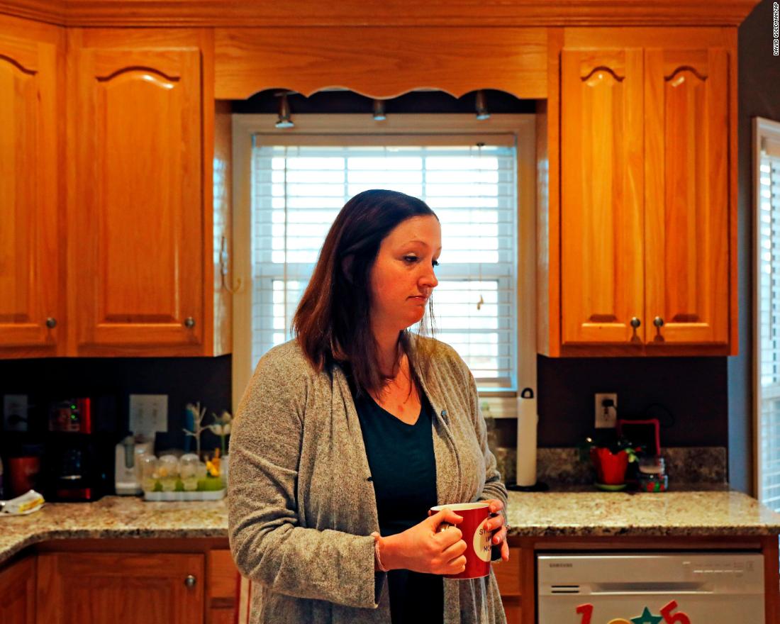 Katie Barron stands in her kitchen while working from home in Madison, Alabama, on Wednesday, January 9. Barron works for a private company not connected to the government, but her husband is a National Weather Service meteorologist who was forced to work without pay because his job is classified as essential.