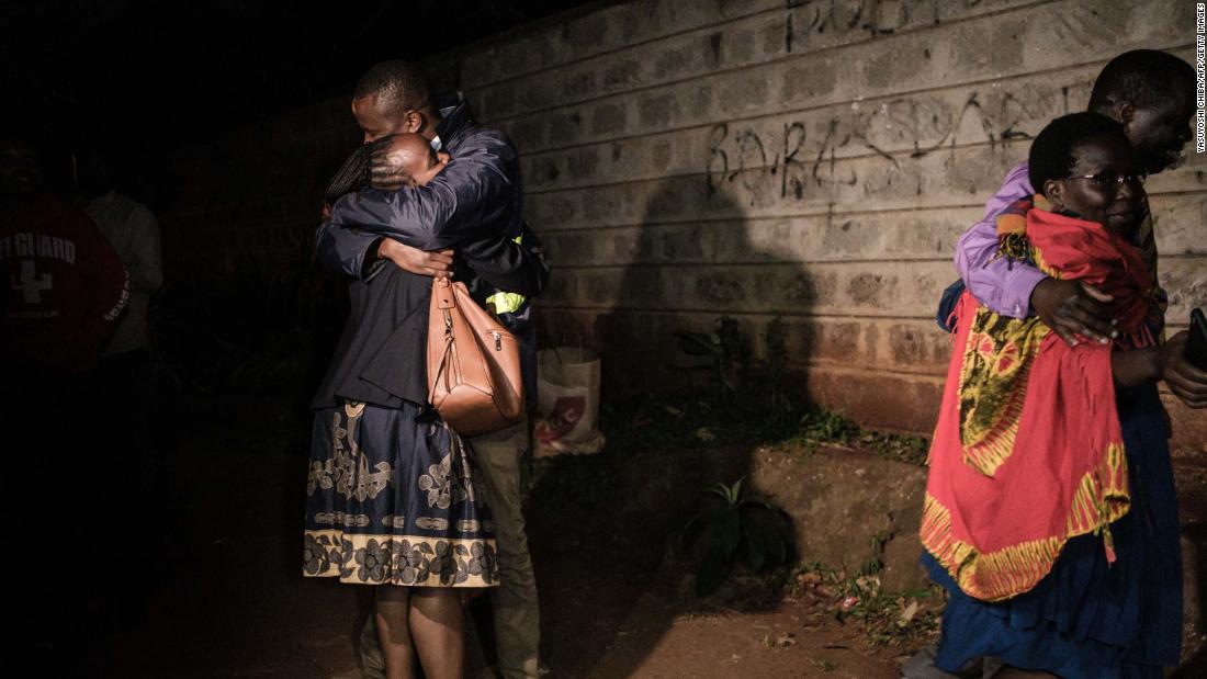 People hug after their evacuation from the DusitD2 compound on Tuesday, January 15.