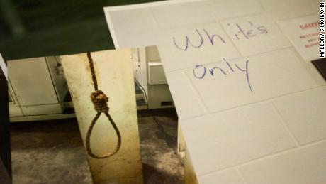 A noose that was found hanging in the plant and graffiti marking the bathroom "White's Only."