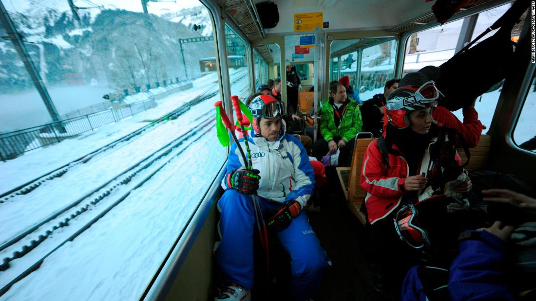 Racers travel up the mountain on a rack railway from Wengen. One-way tickets are all they need.