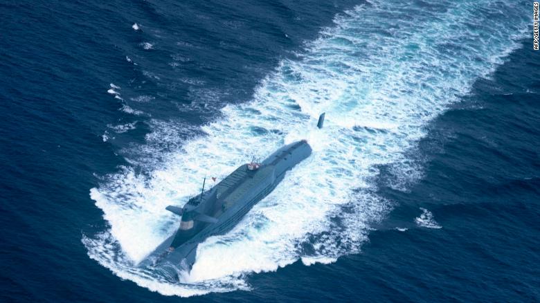 A nuclear-powered submarine of the People&#39;s Liberation Army Navy&#39;s North Sea Fleet prepares to dive into the sea. 