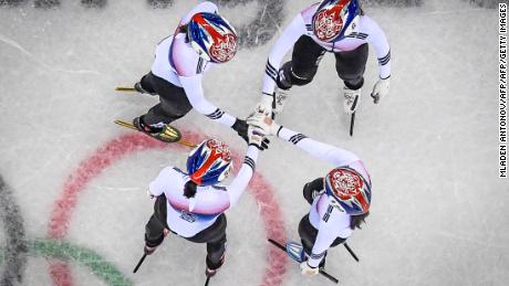 The South Korea team hold hands before winning the women&#39;s 3,000m relay short track speed skating heat event during the Pyeongchang 2018 Winter Olympic Games.