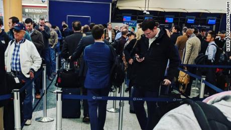 Some travelers waited in security lines for more than two hours at Atlanta's Hartsfield-Jackson International Airport on Monday. The government shutdown has led to increased absences among TSA workers nationwide, putting a strain on airport checkpoints.