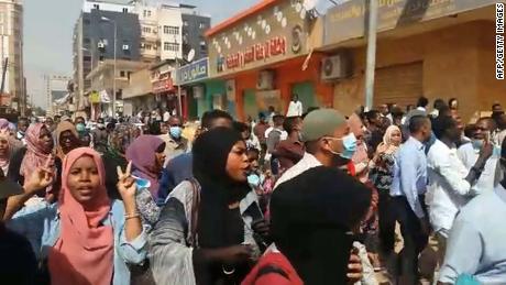 People take part in protests calling for the President's resignation in Khartoum, in an image grab taken from AFP TV on Thursday.