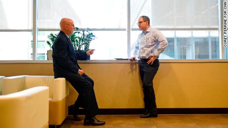 Wall, left, talks with fellow partner Louis Beardell at the Morgan Lewis offices in Philadelphia.